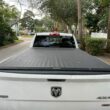 A Ram truck bed cover protects the bed from debris and theives.