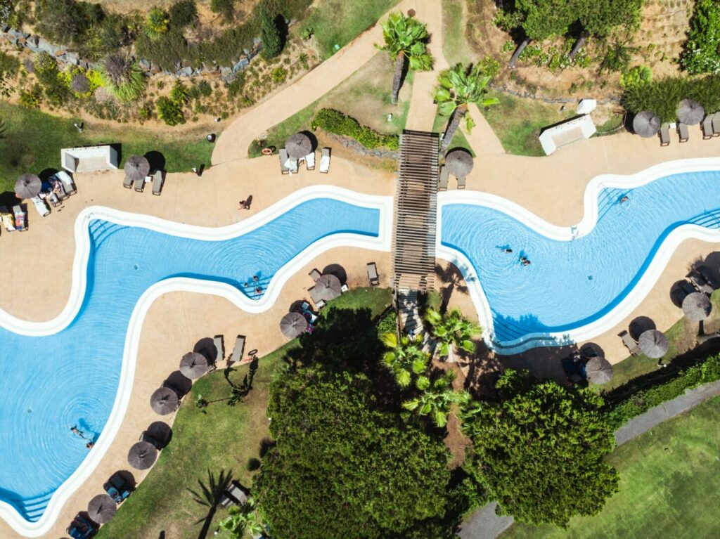 Aerial view of a tropical resort pool.