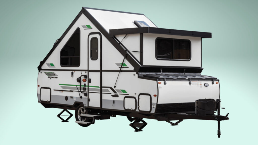 The Forest River Freedom A122S pop up camper with a green background
