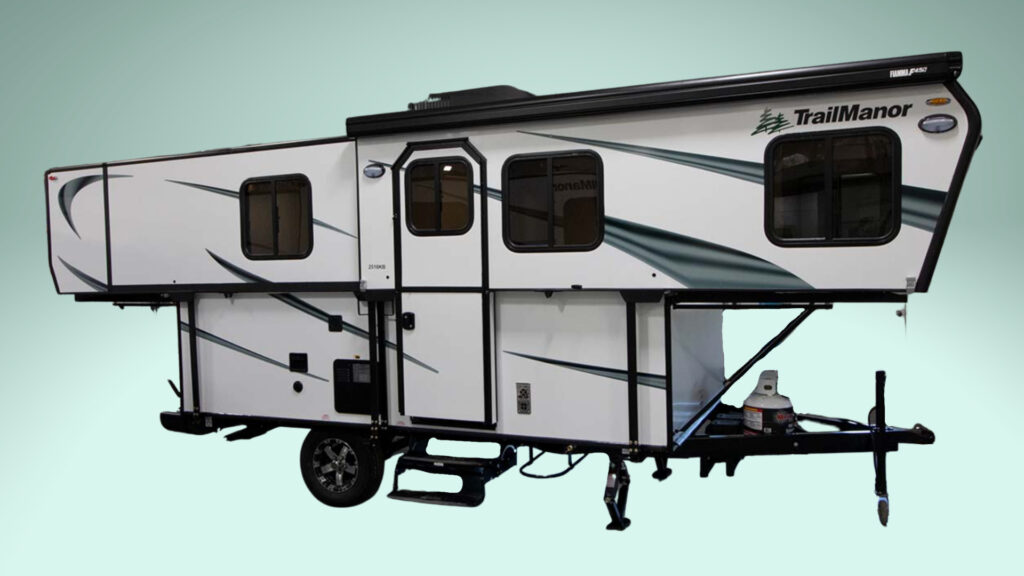 A TrailManor hard sided pop up camper on a green backgroud