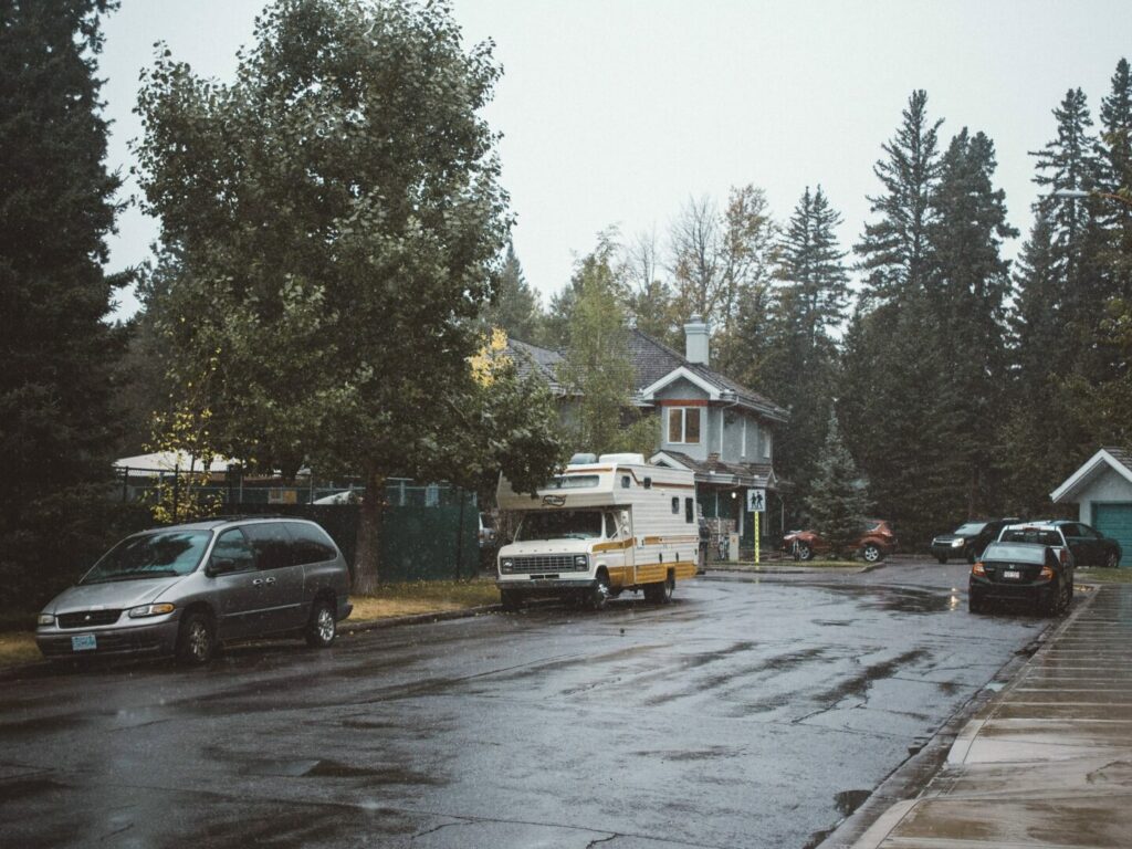 A motorhome parked along a neighborhood street.