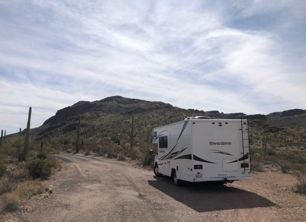 An RV is boondocking in the desert.