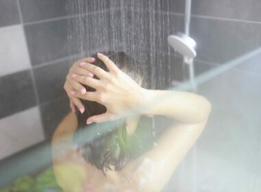 Close up of a woman enjoying a hot shower
