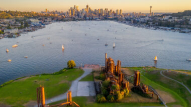 Gas Works Park in Seattle, WA glows alongside Lake Union and the Seattle skyline.