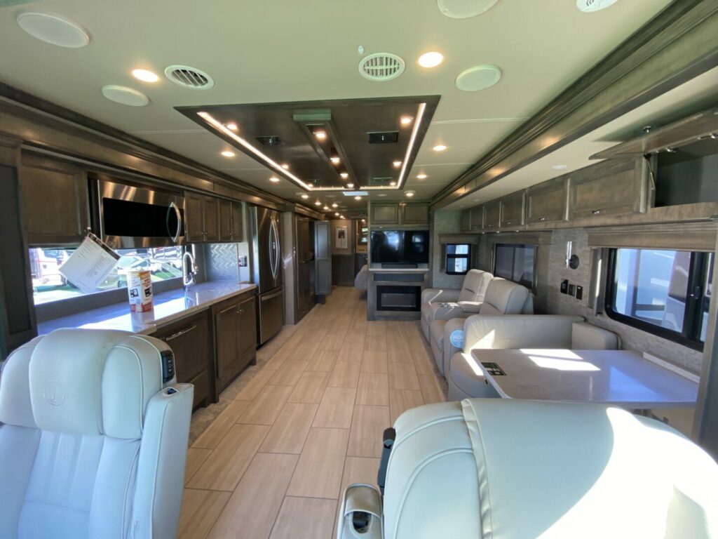 Interior picture of a Class A RV with two slide outs fully extended. These RVs can have high RV prices. 