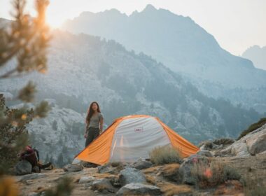 A woman tent camping in California in the mountains.