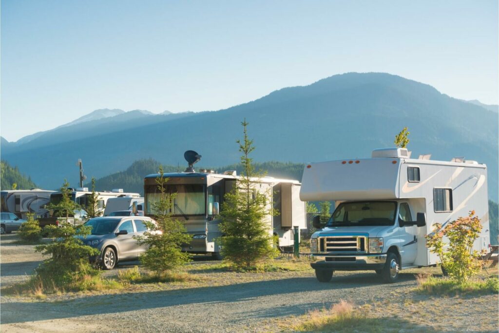 An RV park with different motorhomes parked for camping