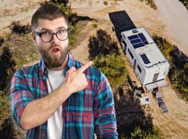 A man wearing a flannel and glasses points to an image of an RV using solar power with a shocked expression in his face.