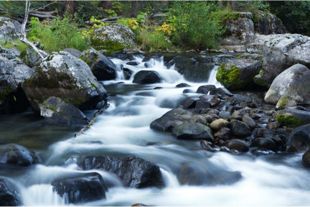 The waters of the Rio Grande River the flows through Colorado cascading over rocky terrain through the mountains