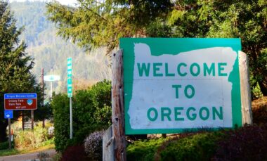 Welcome to Oregon sign as you enter Oregon for your camping trip.