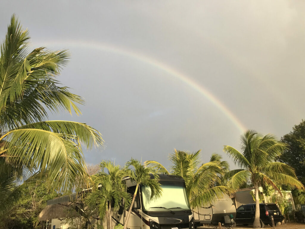 RVs in the florida keys with a rainbow overhead 