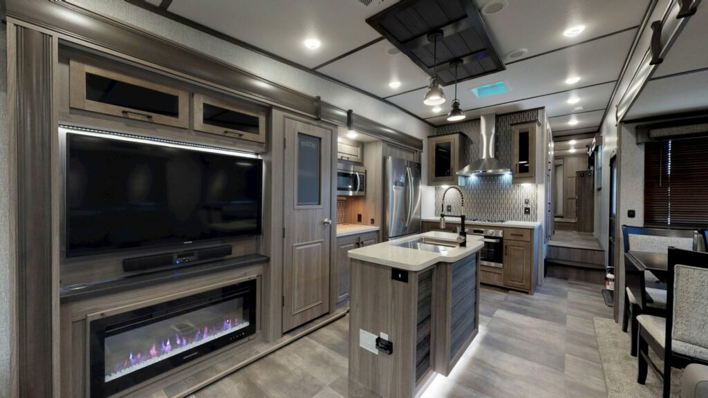 Interior of a brown kitchen in an RV owned by Thor Industries