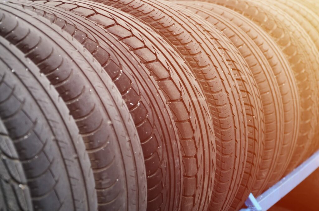 A close up of a variety of tires for purchase if a tire needs replacing. One reason a tire may need replaced is it going out for exceeding tire speed rating.