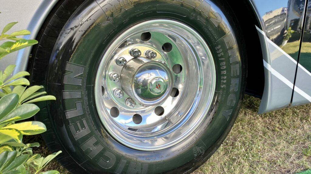 An RV tire showing the tire speed rating on the side