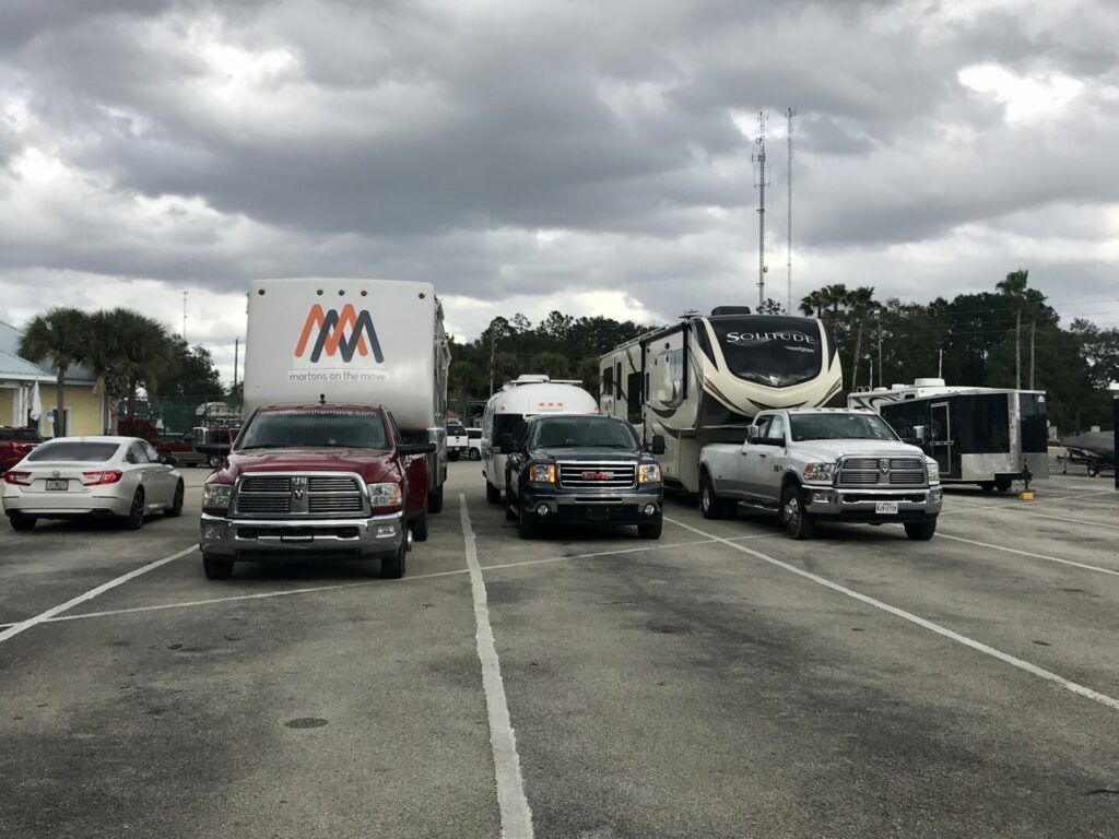 Three RVs parked in row making sure to give enough space