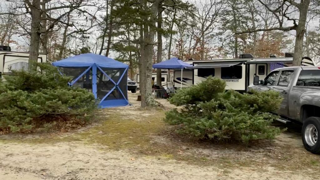 A screen tent setup at a campsite