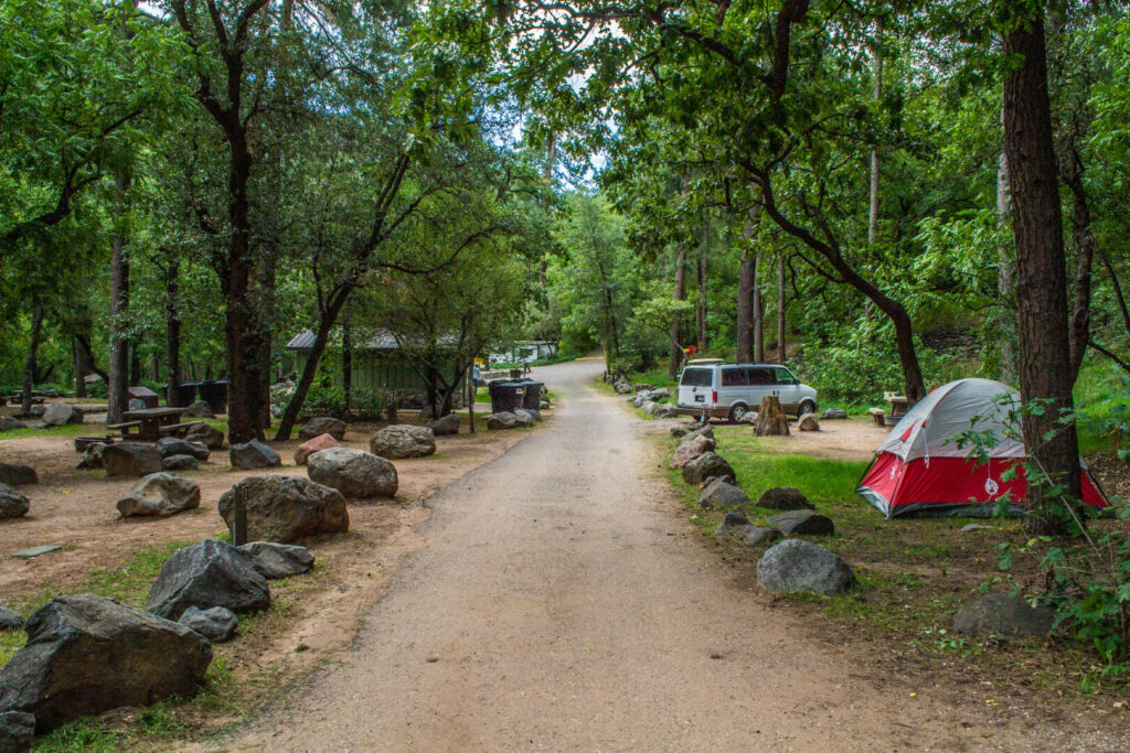View down the road with campsites on each side at the Cave Springs Campground in Sedona, Ariz.
