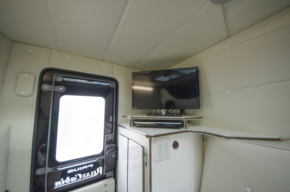 Interior picture of the Prius Camper showing the TV and door