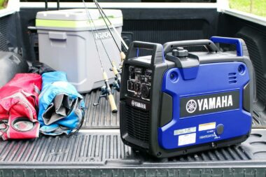 Yamaha EF2200iS generator is sitting in the back of a truck while camping