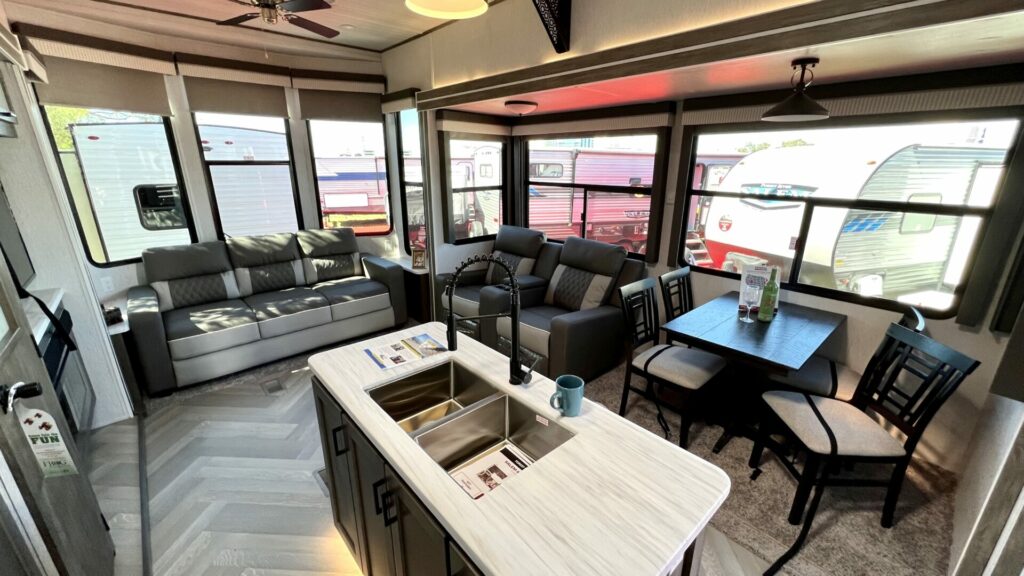 Interior shot of the two story RV showing the kitchen and living room area