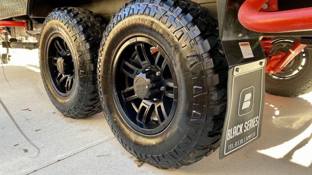 Camper tires with large tread on a Black Series travel trailer
