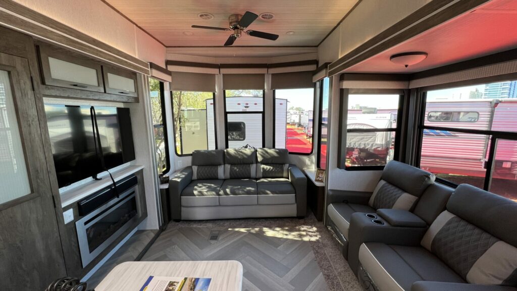 An RV ceiling fan in the living room of a large travel trailer