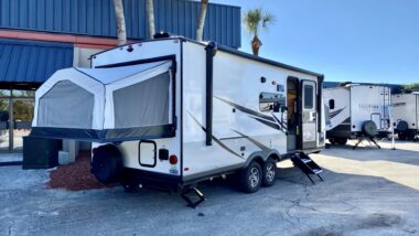 Hybrid camper at an RV show in Florida