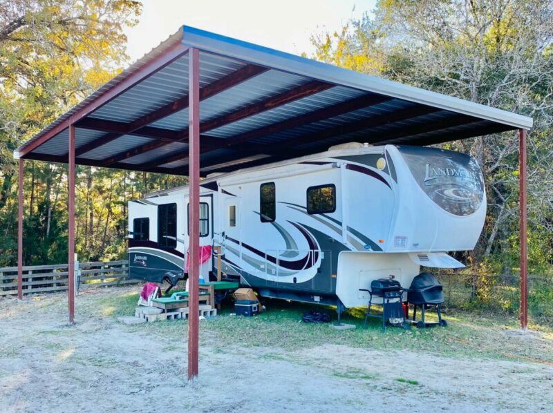 Tall carport installed over a large fifth wheel