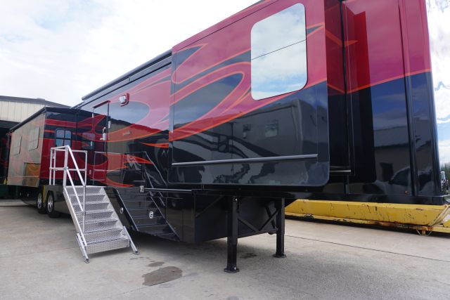 Exterior picture of the red and black 57 Foot Fifth Wheel Camper