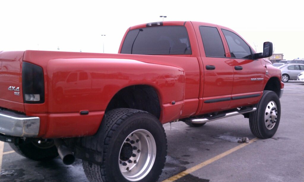 Red Ram truck with ultra wide super single tires on his dually truck