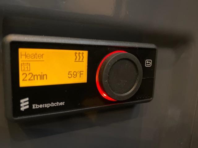 The display screen of an Eberspacher diesel heater showing the temperature as 59 degrees Fahrenheit 