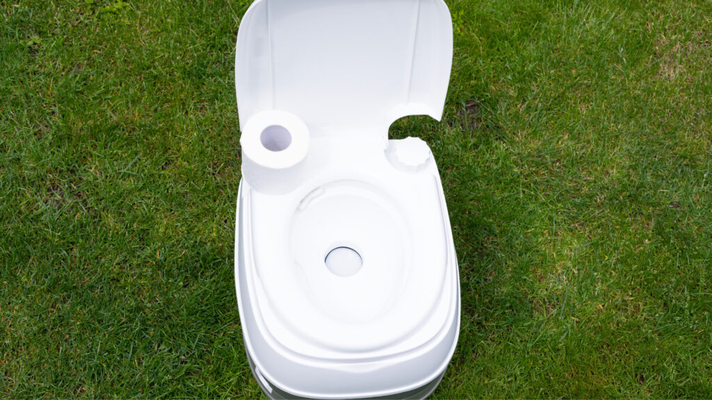 A waterless toilet out in the woods.