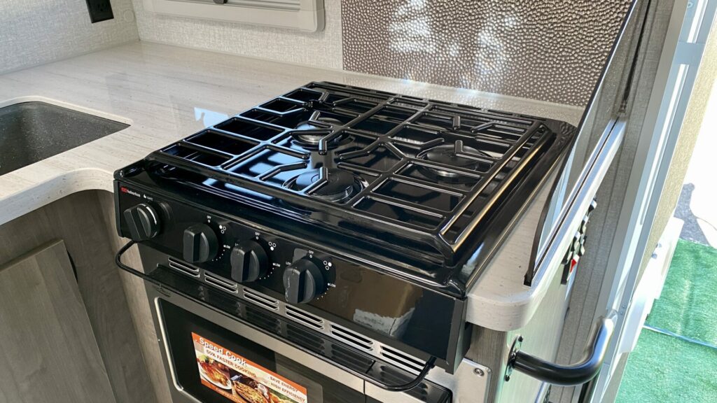 A Suburban RV stove top installed in a truck camper 