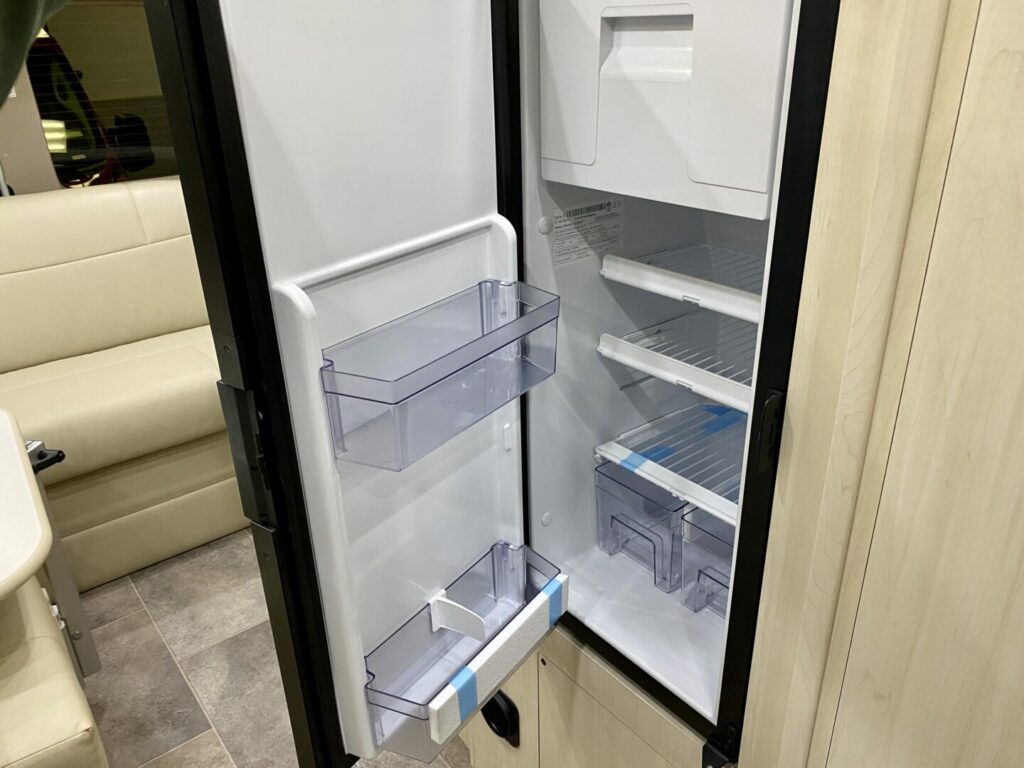 A new RV fridge with the door open 
