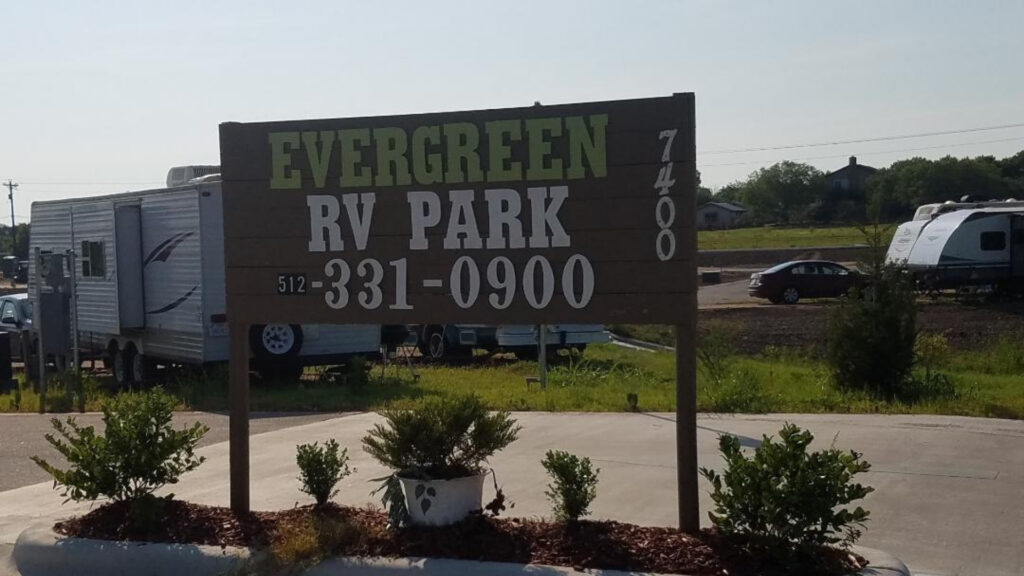 The Evergreen RV Park sign, one of the campgrounds in Austin Texas