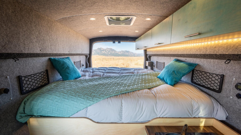 The bedroom area of a Ford Transit Connect camper