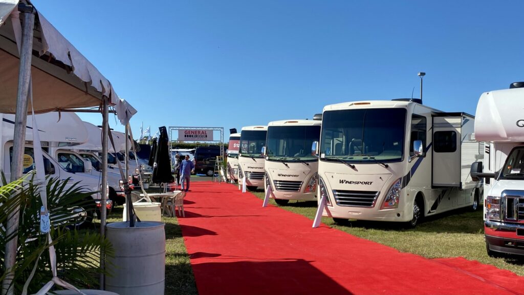 A row of small Class A RVs at an RV show in Florida 