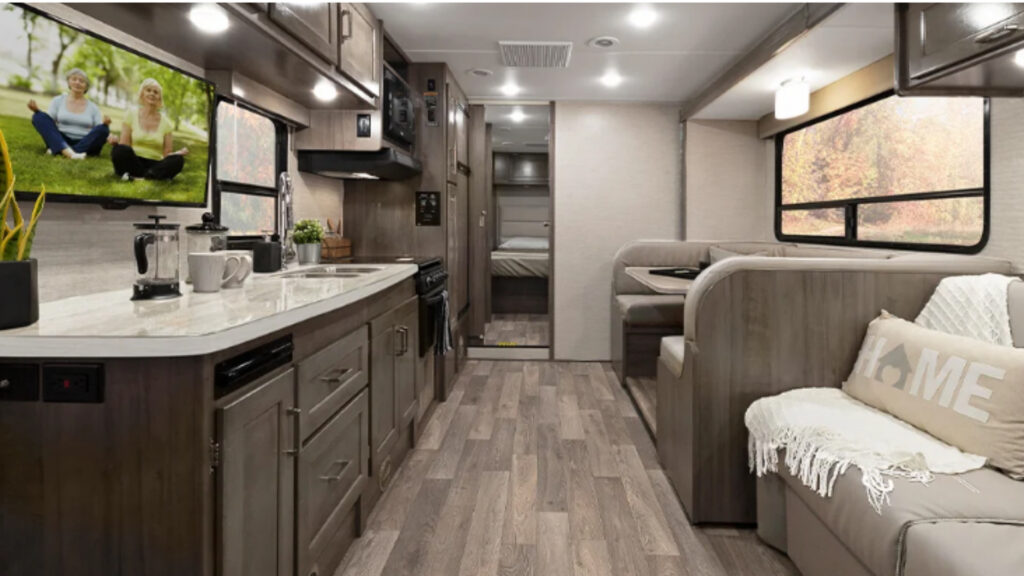 Inside the Winnebago Minnie Winnie 22R displaying the living and kitchen area, one of the worst floorplans.