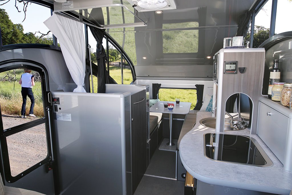 Clean interior view of a 5. Safari Condo Alto R1723 popup trailer