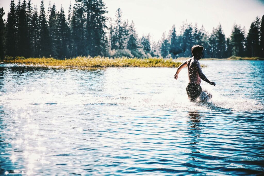 Boy swimming in the  summer at calaveras lake