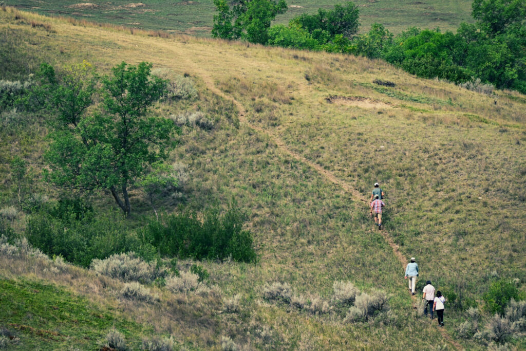 A group of hikers at Theodore Rossevelt National Park, one of the national parks in North Dakota