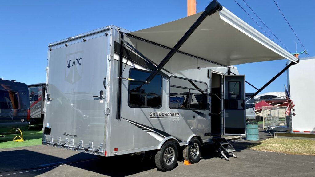 A camper awning open on an ATC toy hauler 