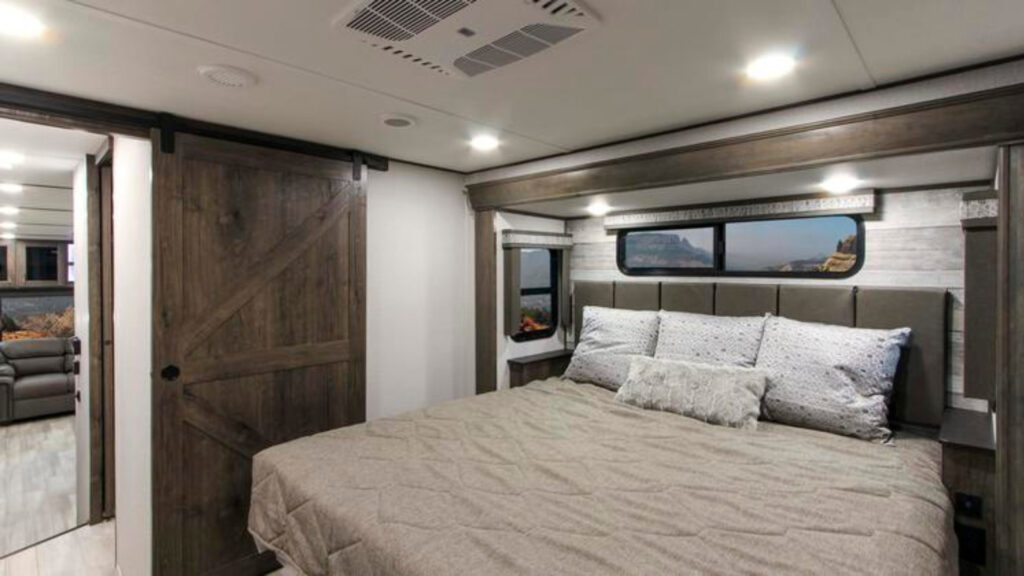 One of the 3 bedrooms in an Alliance Paradigm 390MP RV