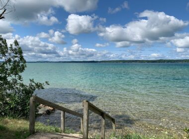 Stairs leading down to torch lake in Michigan