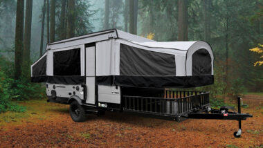 pop up camper toy hauler outside in the woods