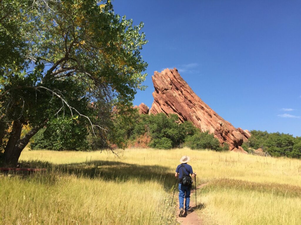 A senior man hiking after using his national park pass for seniors to enter the park