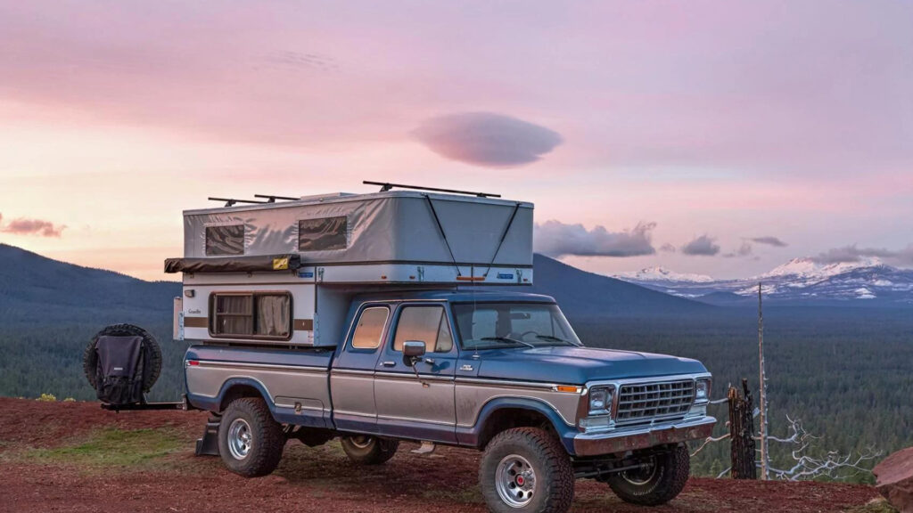A Four Wheel Pop-Up Tacoma Camper outside during sunset