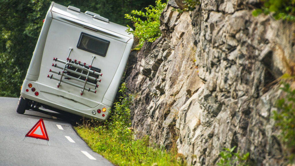 An RV on the side of the road after an accident waiting for the police and to file their motorhome insurance policy