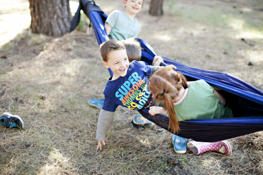 A group of kids laughing at camper van jokes