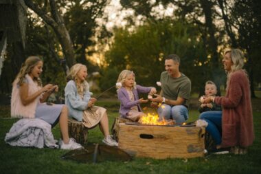 A family camping using their camping fire pit